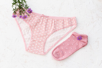 Beautiful women cotton panties and women socks on white background.