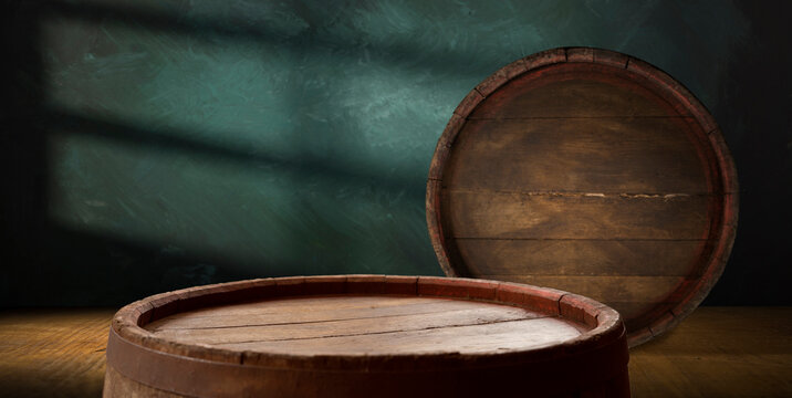A wine cellar full of barrels of wine