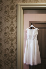 Wedding dress. Wedding fashion. Wedding dress on a hanger. Bride.