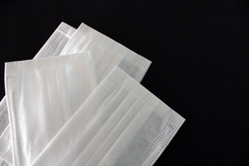 Surgical mask, disposable face protection masks  on black background