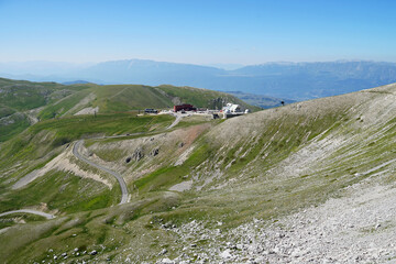 Winding road to Campo Imperatore Observation aerial view, Apennines Mountains with meadows, traveling concept, Gran Sasso National Park, Italia