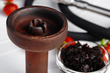 Empty hookah shaft close up on table with fresh fruit