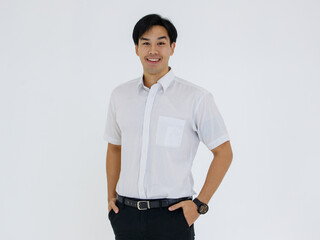 Portrait of Asian young and handsome businessman in casual shirt and slack trousers posing in...