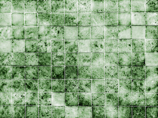 Old grunge green ceramic tile wall for tile background and texture.