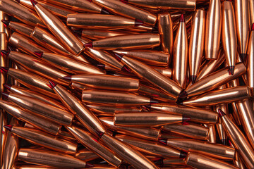 Bullets with a ballistic tip, background that consists of bullets, soft focus