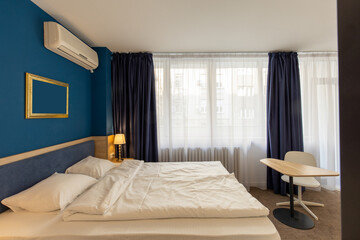Bedroom interior in hotel apartment