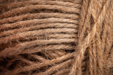Close-up view of natural twine wound on a card. Craft background