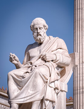 Plato the ancient Greek philosopher and thinker white marble statue under blue sky, Athens Greece