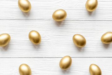 Golden eggs. Easter decoration background. Top view