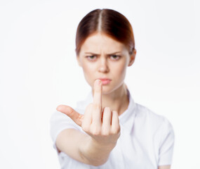 Fototapeta premium red-haired woman in white shirt gesturing with hand emotions studio cropped view