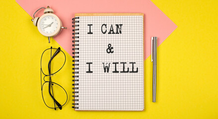 I CAN and I WILL Notice on the notepad with pen, glasses and alarm clock