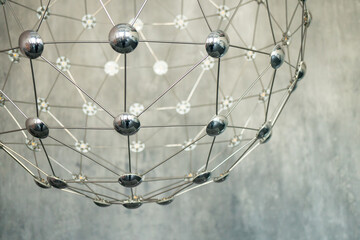 A metal ball on a gray background. Space Decor