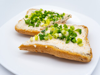 bread with roe salad on white plate
