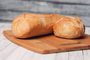loaf with bun fresh baked goods home cooking wood board fresh flavor