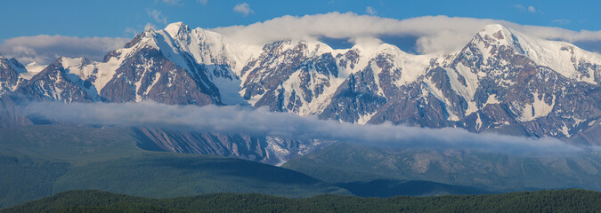 Snow-capped mountain peaks. Traveling in the mountains, climbing. Panoramic view.