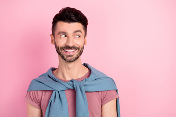 Photo of dreamy charming young happy man look empty space good mood isolated on pink color...