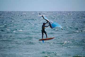 The latest-born board sport wing foiling  at the ocean (Tenerife Island, Spain)
