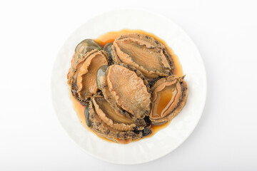 Pickled abalone in soy sauce on a white background