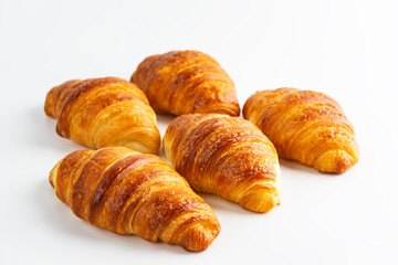 Fresh French croissants on a white background.