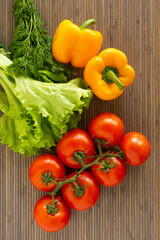 Vegetables on wood bamboo background. Healthy food.