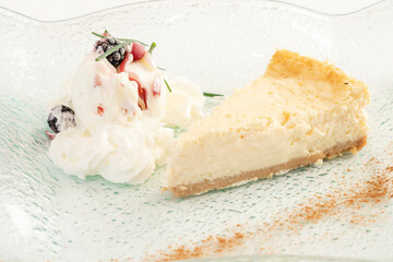 Cheesecake with red fruits and cream
