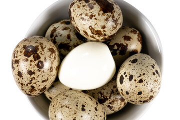 Boiled spotted quail eggs in a white ceramic  bowl , isolated on white background.  Healthy Food Products Concept