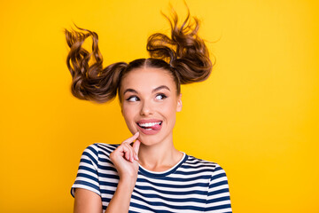 Photo of sweet funny young woman wear striped clothes air blowing finger chin looking empty space...