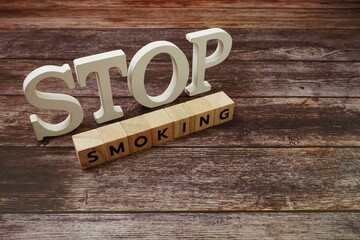Stop Smoking Word alphabet letters on wooden background