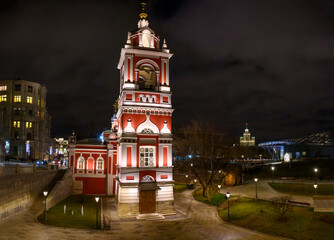 night view of city church with red walls and white backlight