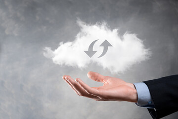 Cloud technology. Polygonal wireframe cloud storage sign with two arrows up and down on dark ....