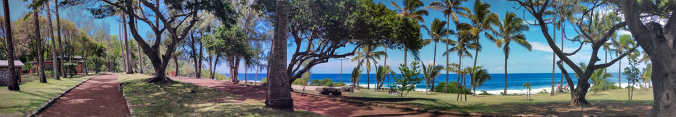 Obraz na płótnie Canvas Large Panorama of Grand Anse Reunion Beach visitors pathways