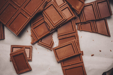 chocolate broken on brown paper on a delicacy table
