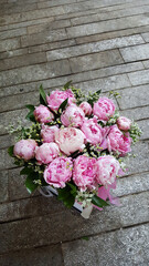 Elegant bouquet of a lot of peonies of pink color close up. Beautiful flower for any holiday. Lots of pretty and romantic flowers in floral shop 