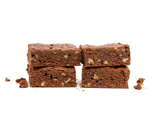 stack of baked chocolate brownie pieces with walnut isolated on white background