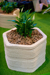 Concrete flower bed created using modern 3D printing technology from special concrete.