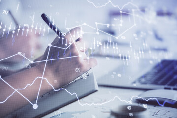 Double exposure of forex graph drawing over people taking notes background. Concept of financial analysis