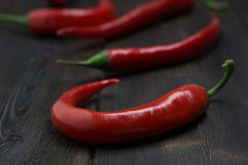 Hot peppers on a wooden background ingredient spicy