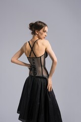 Elegant slim woman in skirt and corset