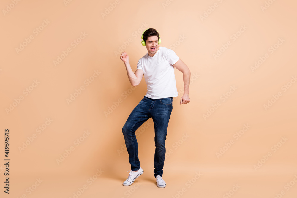 Canvas Prints Full length photo of excited cheerful person dancing closed eyes nice weekend isolated on beige color background