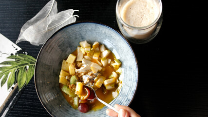 Eating healthy Breakfast smoothie bowl with latte. Acai Smoothie, Granola, Seeds, Fresh Fruits. Clean Eating, Dieting, Detox, Vegetarian, Vegan Food Concept.