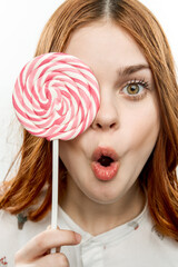 cheerful pretty woman with lollipop near face sweets dessert