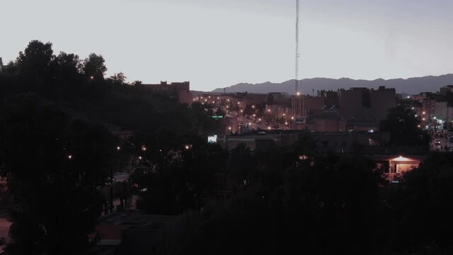 day to night timelapse of the main avenue of Ouarzazate