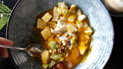 Eating healthy Breakfast smoothie bowl. Acai Smoothie, Granola, Seeds, Fresh Fruits. Clean Eating, Dieting, Detox, Vegetarian, Vegan Food Concept.