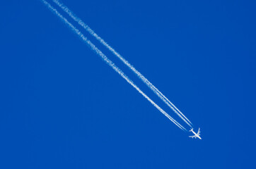 Airplane descending is removed leaving a white contrails behind it