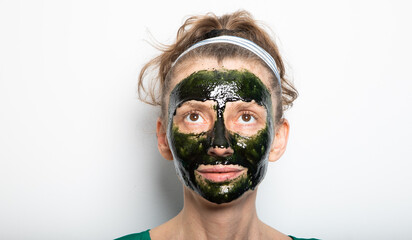 woman wearing green spirulina face mask