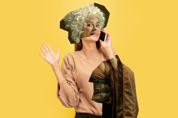Woman talking phone. Magazine style collage with model outfit mixed of different eras. Copyspace...