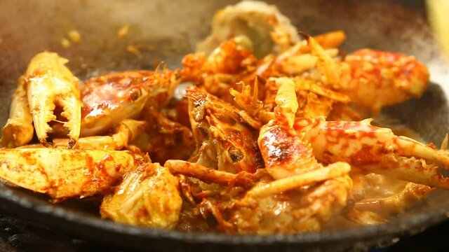 Frying crabs with curry powder in pan, Thai famous food.
