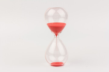 Crystal hourglass on light background as a concept of passing time for business term, urgency and outcome of time.
