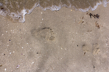 The background of sand with water splash into summer with space for text.