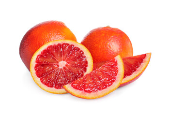 Whole and cut red oranges on white background